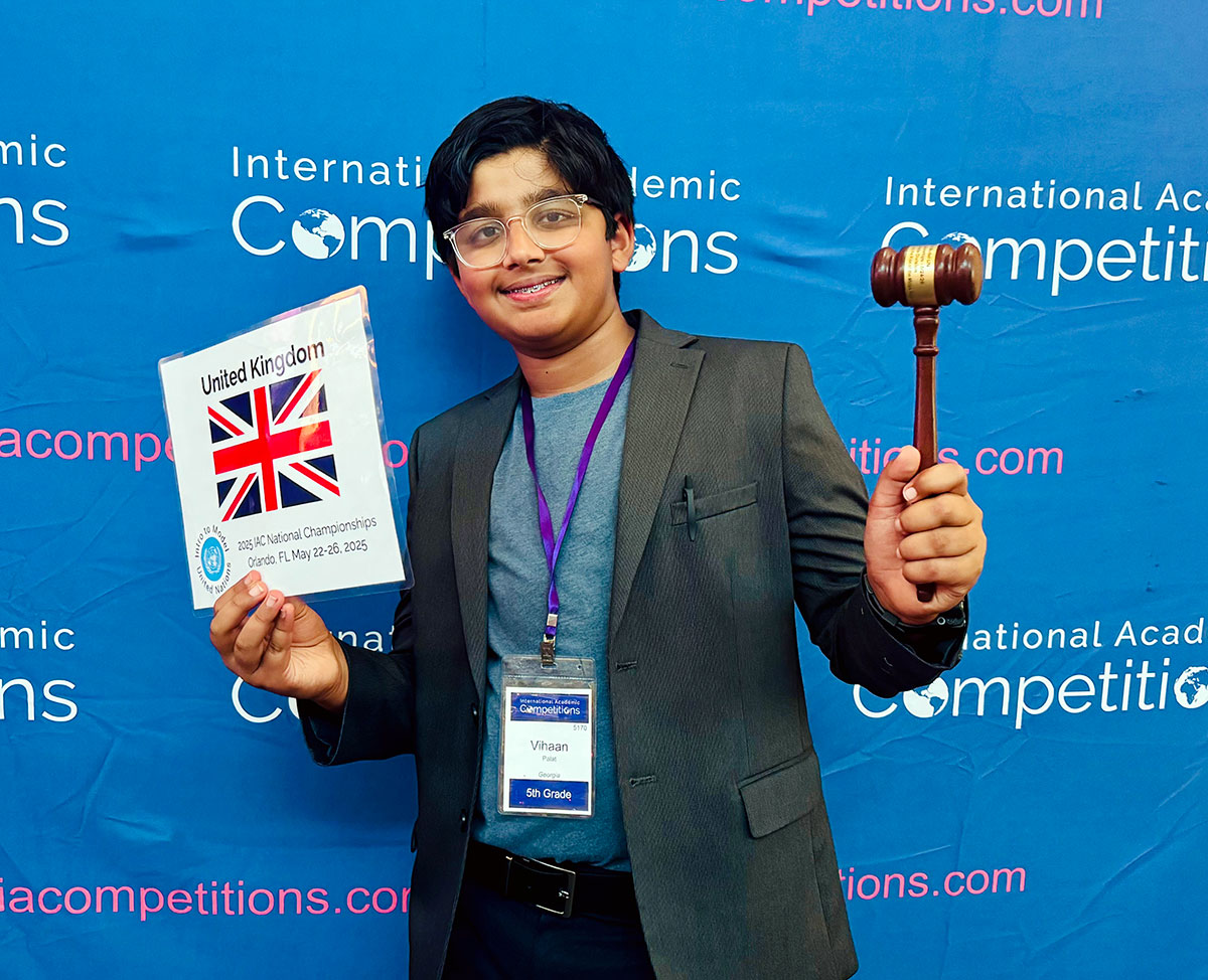 A Best Delegate with the traditional gavel at the 2025 Intro to Model UN Program